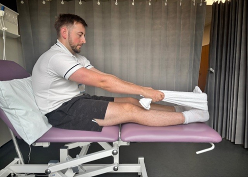 calf stretch with towel.png