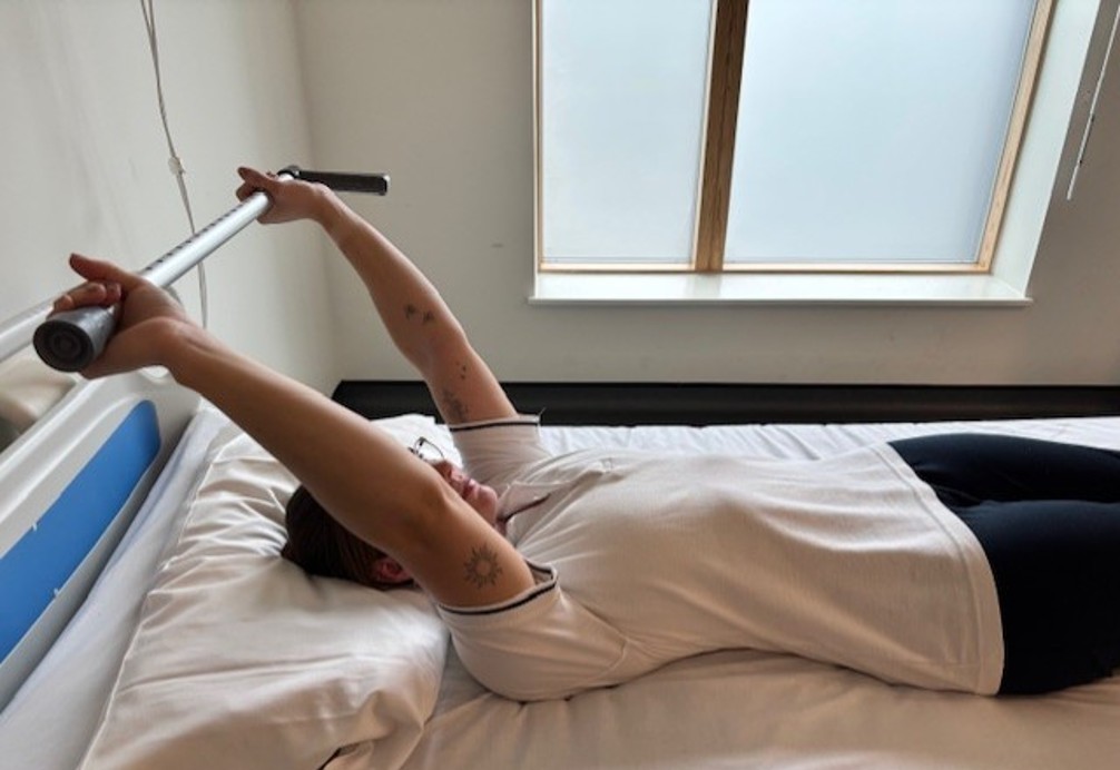 supine shoulder flexion assisted.jpg