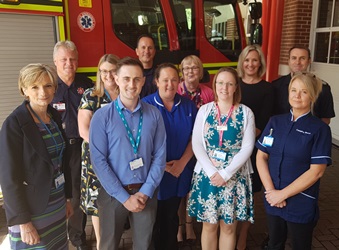 Health Minister Caroline Dinenage meets members of the NHS and fire service staff working together in community care team